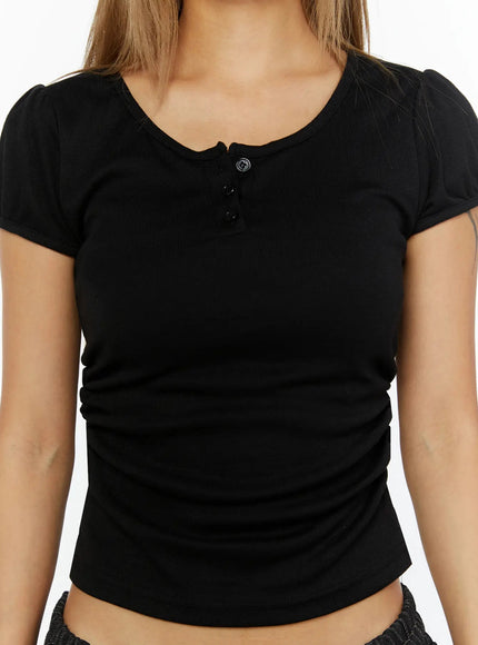 Puff Sleeve Henley Tee IL524 Black close-up front shot on model showing three-button henley placket scoop neckline and side ruching detail