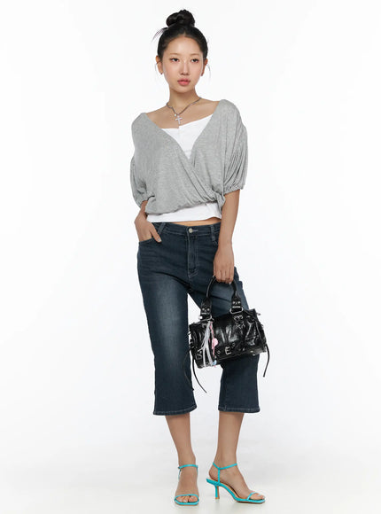 Puff Wrap V-Neck Tee CL510 Gray full-length front shot on model with bun updo, wrap crossover bodice, puff balloon sleeves, layered over white cami, styled with cropped jeans and teal heeled sandals