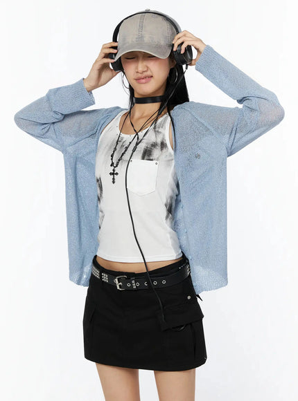 LEWKIN Raglan Sheer Open Knit Cardigan IL509 Light blue front shot model wearing headphones and baseball cap styled with white graphic tank and black mini skirt S/M