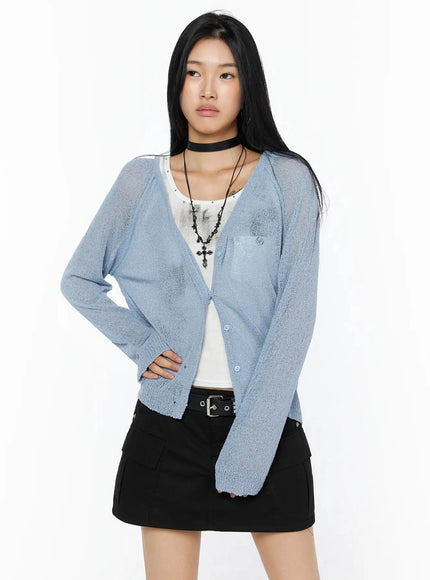 Raglan Sheer Open Knit Cardigan IL509 Light blue front close-up shot model showing V-neckline button placket semi-transparent knit fabric with white tank visible underneath
