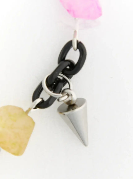 Raven Halloween Necklace IL517 Black close-up detail of silver cone spike charm hanging from black oval chain links