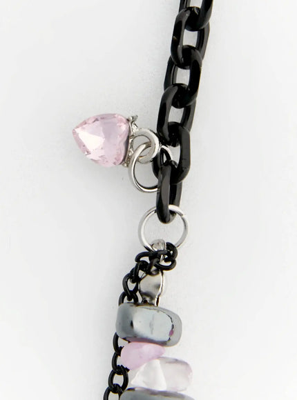 Raven Halloween Necklace IL517 Black close-up detail of pink heart-shaped crystal charm and double chain strand with hematite and pastel beads