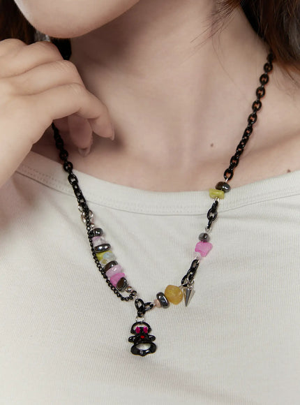 LEWKIN Raven Halloween Necklace IL517 Black front view on model wearing white top showing ghost pendant colorful beads and layered chain