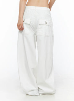 LEWKIN Relaxed Fit Baggy Pants CL502 White size S back view on model showing double flap pockets with silver buttons and contrast stitching