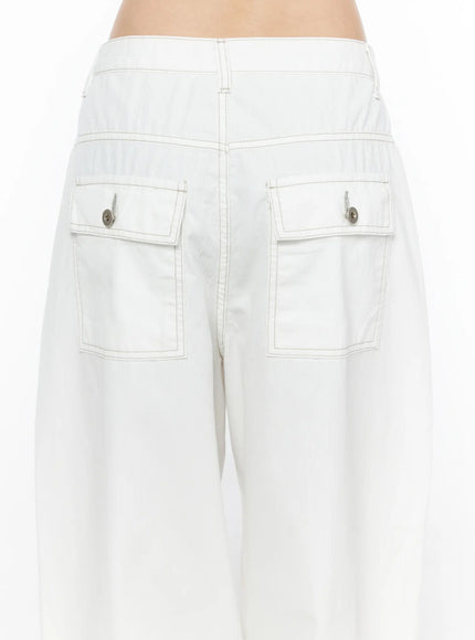 Relaxed Fit Baggy Pants CL502 White close-up back detail showing two large flap pockets with silver snap buttons and contrast stitching on wide-leg trousers