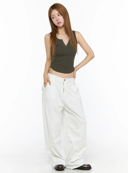 Relaxed Fit Baggy Pants CL502 White three-quarter front view on model styled with olive tank top hand raised to hair side pocket visible