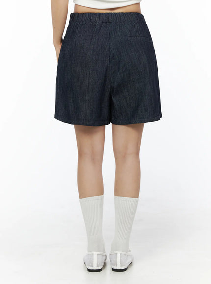 Relaxed-Fit Pintuck Shorts IU525 Dark blue back view on model showing elastic waistband clean seam and relaxed wide-leg denim silhouette