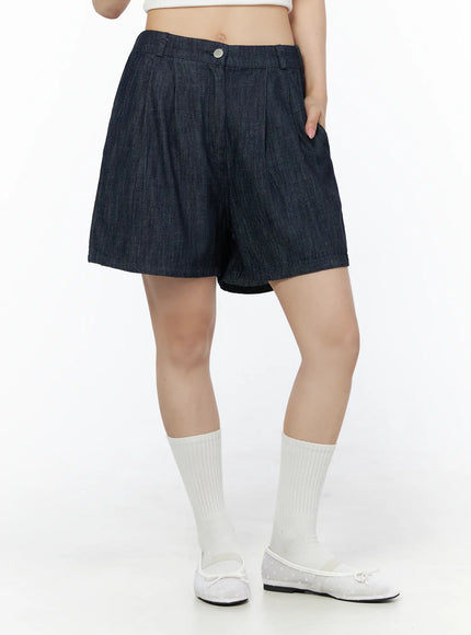 Relaxed-Fit Pintuck Shorts IU525 Dark blue side-angle close-up on model showing pintuck pleats silver button waistband and wide leg