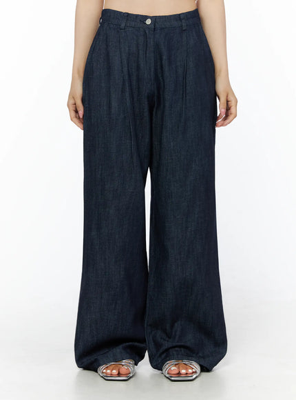 LEWKIN Relaxed-Fit Wide-Leg Pants IU525 Dark blue front crop shot on model size XS showing high-waist pleated denim with silver button and wide-leg silhouette