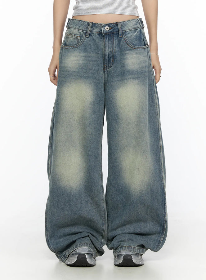 Rey Vintage Washed Wide Leg Jeans CL524 Blue front shot on model, low-rise waistband with sun-faded yellow-green wash, wide balloon leg, hands in pockets