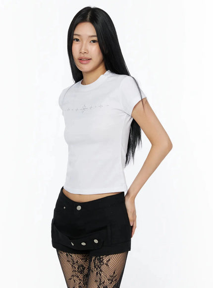 Rhinestone Slim Fit Short Sleeve Tee IL509 White three-quarter side shot on model with hand on hip showing rhinestone embellishment and crop length