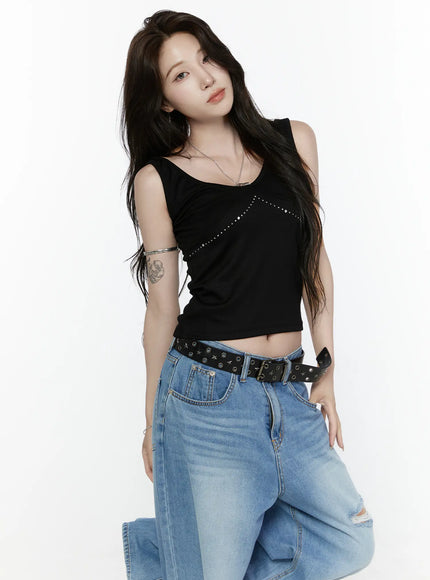 Rhinestone V-Neck Tank Top IL522 Black front shot on model leaning slightly, rhinestone V-neck seam detail on cropped black jersey tank top