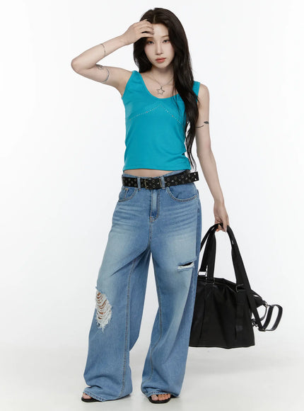 Rhinestone V-Neck Tank Top IL522 Blue full-body front shot on model with hand raised to forehead, styled with ripped wide-leg jeans and black bag