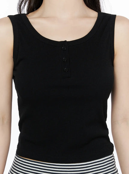 Ribbed Button Tank Top IU525 Black close-up detail shot highlighting three henley buttons scoop neckline and ribbed texture on model