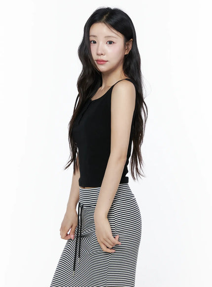 Ribbed Button Tank Top IU525 Black side model shot cropped ribbed henley tank showing slim profile and side seam paired with striped maxi skirt