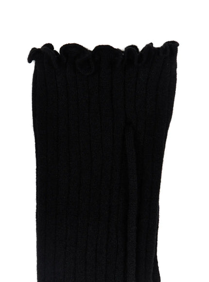 Ribbed Buttoned Leg Warmers CL523 Black close-up detail shot showing ruffled gathered top edge with tie cord and soft ribbed knit fabric texture