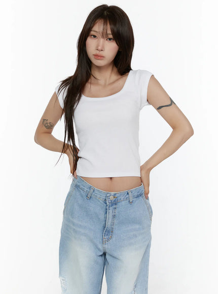 Ribbed Cap Sleeve Top CL508 White front shot on model hands on hips showing scoop neckline ribbed texture and cropped hem