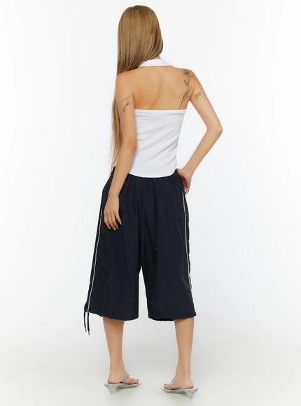 Ribbed Halter Neck Top IL524 White back shot on model revealing open halter back design, wide strap construction, and ribbed fabric texture