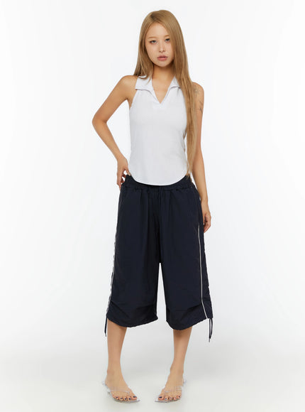 Ribbed Halter Neck Top IL524 White full-length front shot on model standing with hand on hip, styled with navy cropped wide-leg drawstring pants