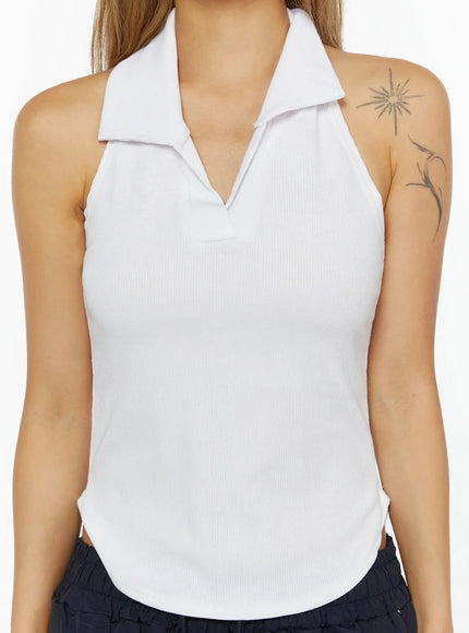 Ribbed Halter Neck Top IL524 White close-up front detail shot on model showing open polo collar, V-neckline, and ribbed knit texture