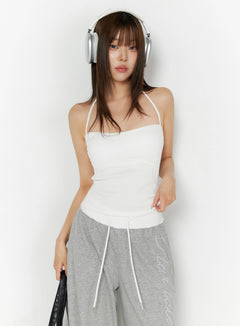 LEWKIN Ribbed Halter Sleeveless Top IL515 White front view on model wearing headphones styled with gray wide-leg sweatpants