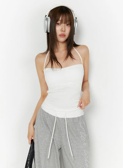 LEWKIN Ribbed Halter Sleeveless Top IL515 White front view on model wearing headphones styled with gray wide-leg sweatpants