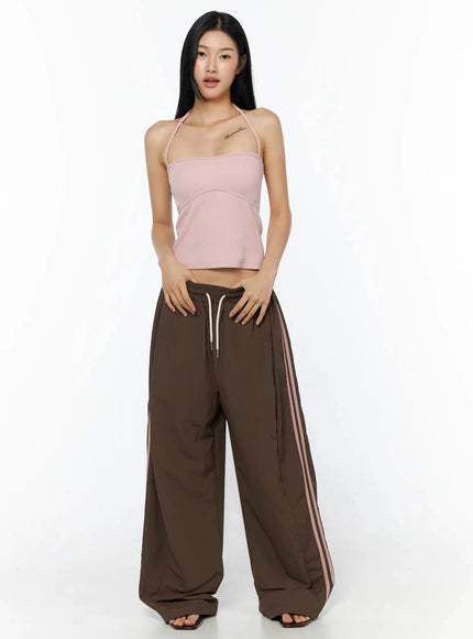 Ribbed Halter Top IL509 Pink full-length front view model standing upright wearing halter ribbed crop top with brown wide-leg stripe pants