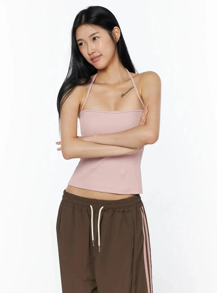 Ribbed Halter Top IL509 Pink front view model arms crossed showing ribbed knit texture halter neckline and fitted waist crop length