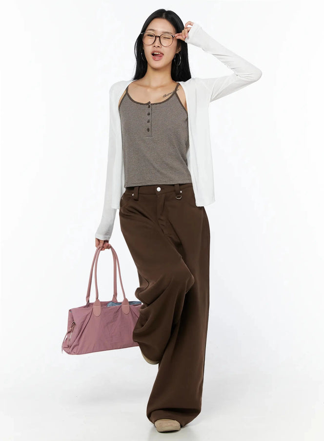 LEWKIN Ribbed Open Knit Cardigan IL509 White S/M full-body front shot on model walking, styled with striped cami and brown wide-leg trousers, carrying pink bag