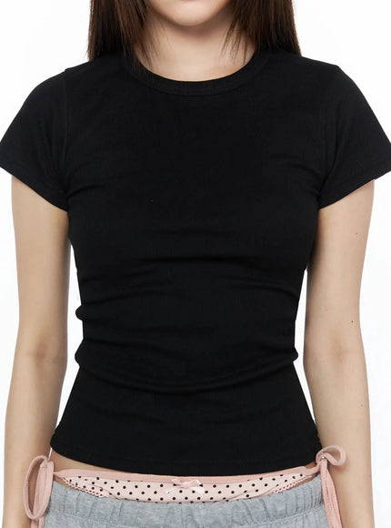 Ribbed Short Sleeve Tee IL515 Black close-up front shot model wearing fitted ribbed short sleeve tee showing crew neckline and ribbed fabric texture detail
