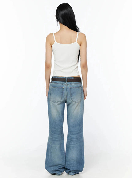 Ribbed Sleeveless Top IL509 White back full-body shot, model facing away showing plain ribbed back with thin spaghetti straps and scoop neckline, low-rise flared jeans