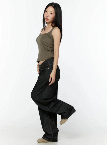 Ribbed Slim Tank Top IL516 Dark brown side model shot with leg raised showing cropped hem and fitted ribbed silhouette styled with black wide-leg denim