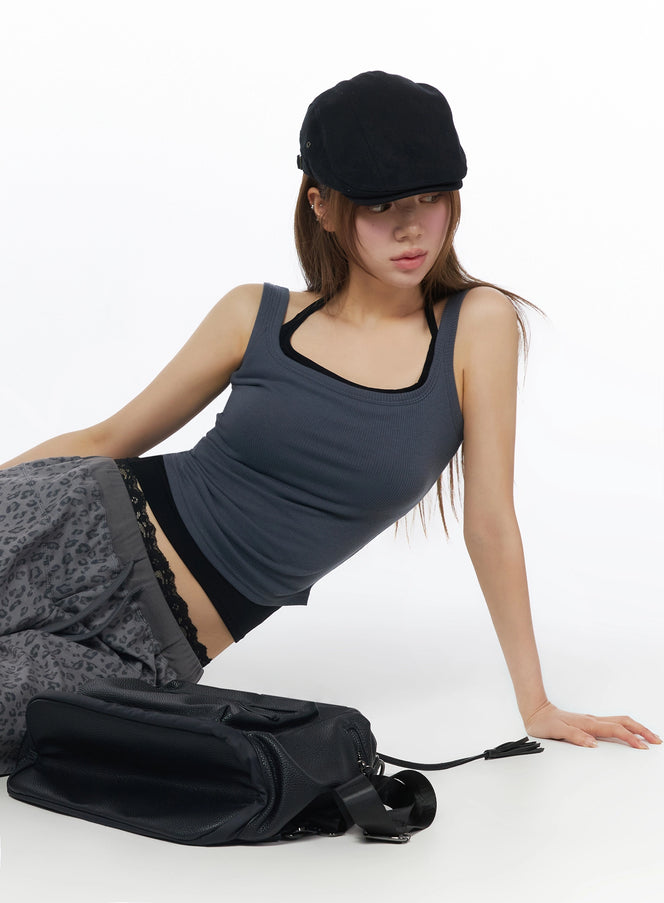 LEWKIN Ribbed Square Neck Padded Tank Top IU525 Dark gray front shot on seated model wearing black cap, leopard pants, black bag, ribbed fitted silhouette