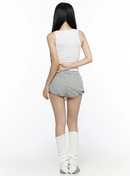Ribbed Tank Top CL527 White back view on model, ribbed crop tank showing plain back panel and scoop neckline, paired with gray bubble shorts and white ruffled leg warmers