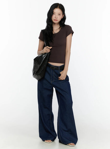 Ribbed U-Neck Tee CL520 Dark brown full-body front model shot standing upright hands at sides slim crop fit with wide-leg jeans black braided belt and bag