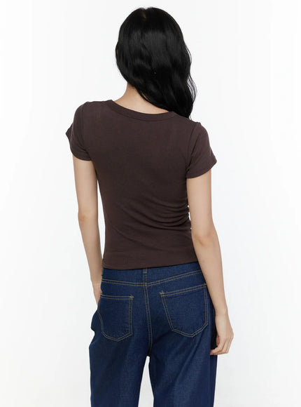 Ribbed U-Neck Tee CL520 Dark brown back model shot displaying back neckline ribbed texture slim fitted crop cut and cap sleeve construction paired with denim