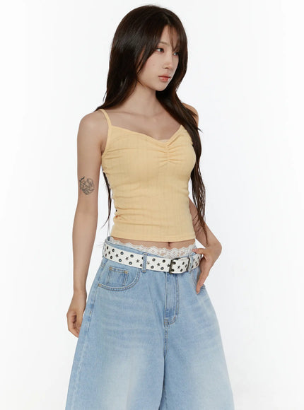 Ribbed V-Neck Cami Top CL508 Yellow angled half-body front shot on model showing ruched chest detail and slim silhouette with lace trim visible at hem