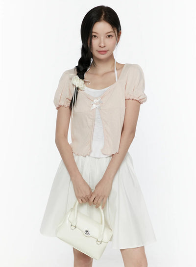 LEWKIN Ribbon Detail Puff Short Sleeve and Halter Set IL506 Light pink S/M front view on model with braided hair holding white handbag styled over white flared skirt