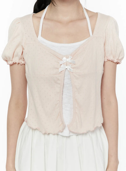 Ribbon Detail Puff Short Sleeve and Halter Set IL506 Light pink close-up front detail showing double satin bow closure open-front pointelle knit texture and ruffled hem