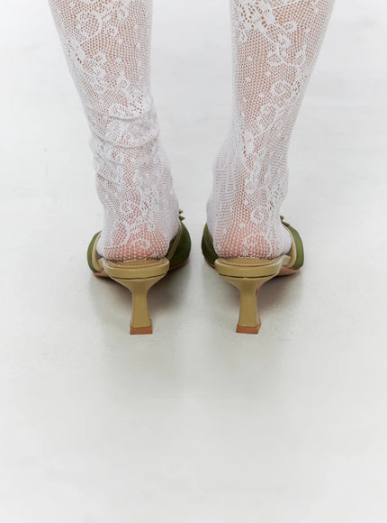 Ribbon Detail Sandal Heels CU524 Green back close-up on model showing sculptured kitten heel shape and open back mule silhouette with lace socks