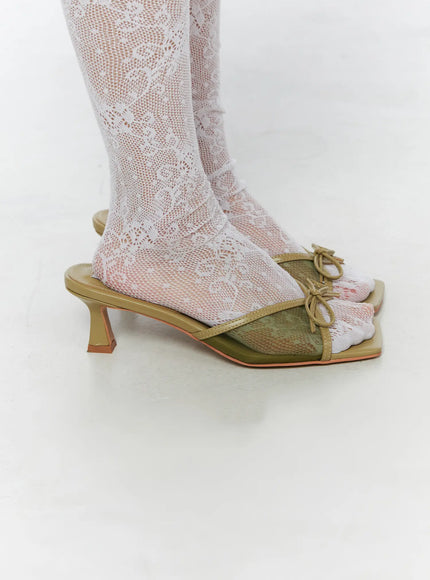 Ribbon Detail Sandal Heels CU524 Green side close-up on model highlighting single shoe profile with sculptured kitten heel mesh upper and bow