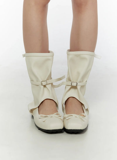 LEWKIN Ribbon Flat Ankle Boots CL507 Light beige front view on model standing straight showing bow toe detail and buckle strap gaiter faux-leather