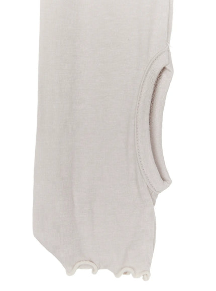 Ribbon Layered Leg Warmers CL503 Pink close-up detail of ankle stirrup strap and lettuce-edge hem finish on beige knit fabric texture