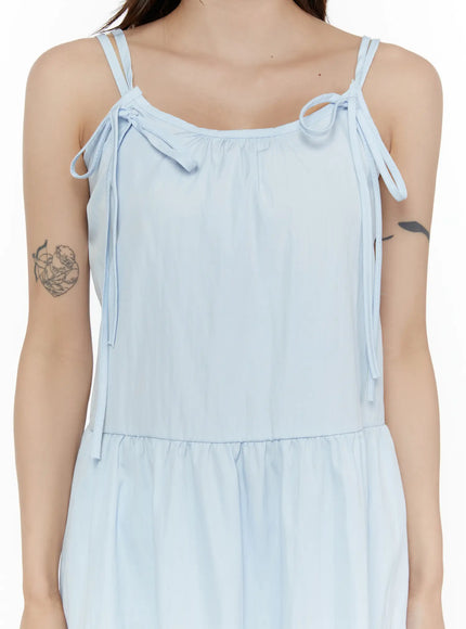 Ribbon Mini Dress CL508 Light blue close-up detail shot on model showing double spaghetti straps with ribbon bow ties and gathered scoop neckline