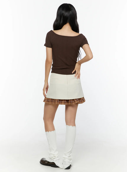 Ribbon Pleated Mini Skirt CU526 Light beige full-body back shot on model showing back zipper brown plaid ruffle hem styled with brown ribbed top