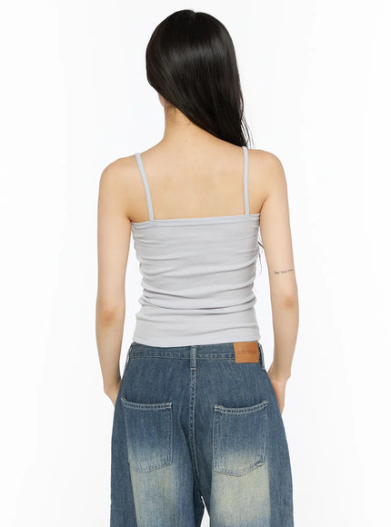 Ribbon Strap Cami CU530 Gray back shot on model, showing straight back neckline, thin spaghetti straps, and ribbed knit texture of gray crop cami
