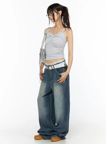 Ribbon Strap Cami CU530 Gray three-quarter side full-body shot on model looking down, silver shoulder bag, ribbed knit cami with lace waistband and wide-leg jeans