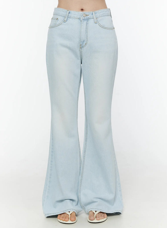 LEWKIN Ripley Light Washed Flared Jeans IL506 Light blue Size S front close-up on model showing waistband button fly front pockets and flared denim leg with white sandals