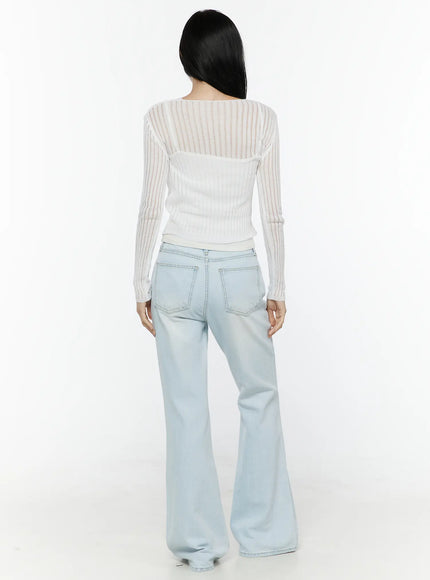 Ripley Light Washed Flared Jeans IL506 Light blue back full-length shot on model showing rear pockets contrast stitching and flared silhouette paired with white cardigan