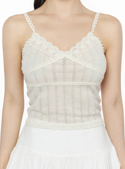 Romantic Lace Cami Top IU525 Light beige front model waist-up shot, hands on hips, lace scallop neckline and empire waist lace band detail visible